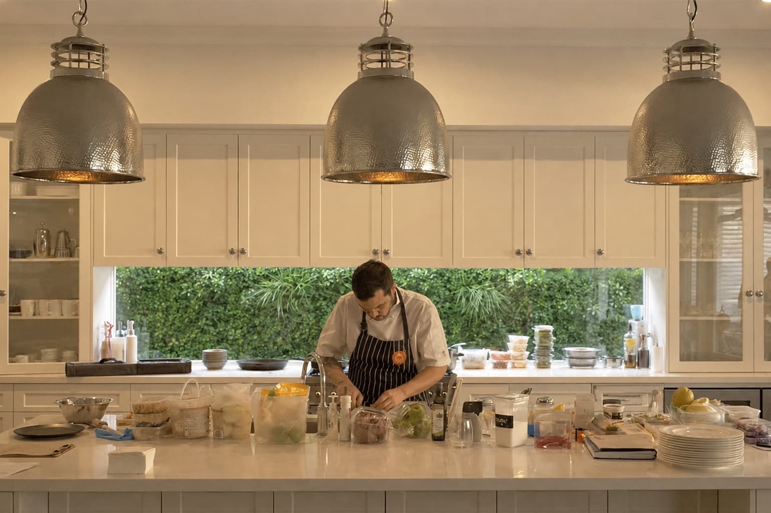 A Biotrofi chef prepping in a warm home kitchen